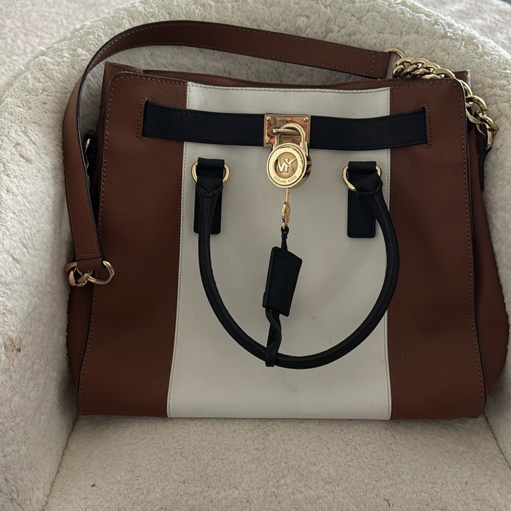 Michael Kors Brown, White, and Black over the shoulder medium size handbag